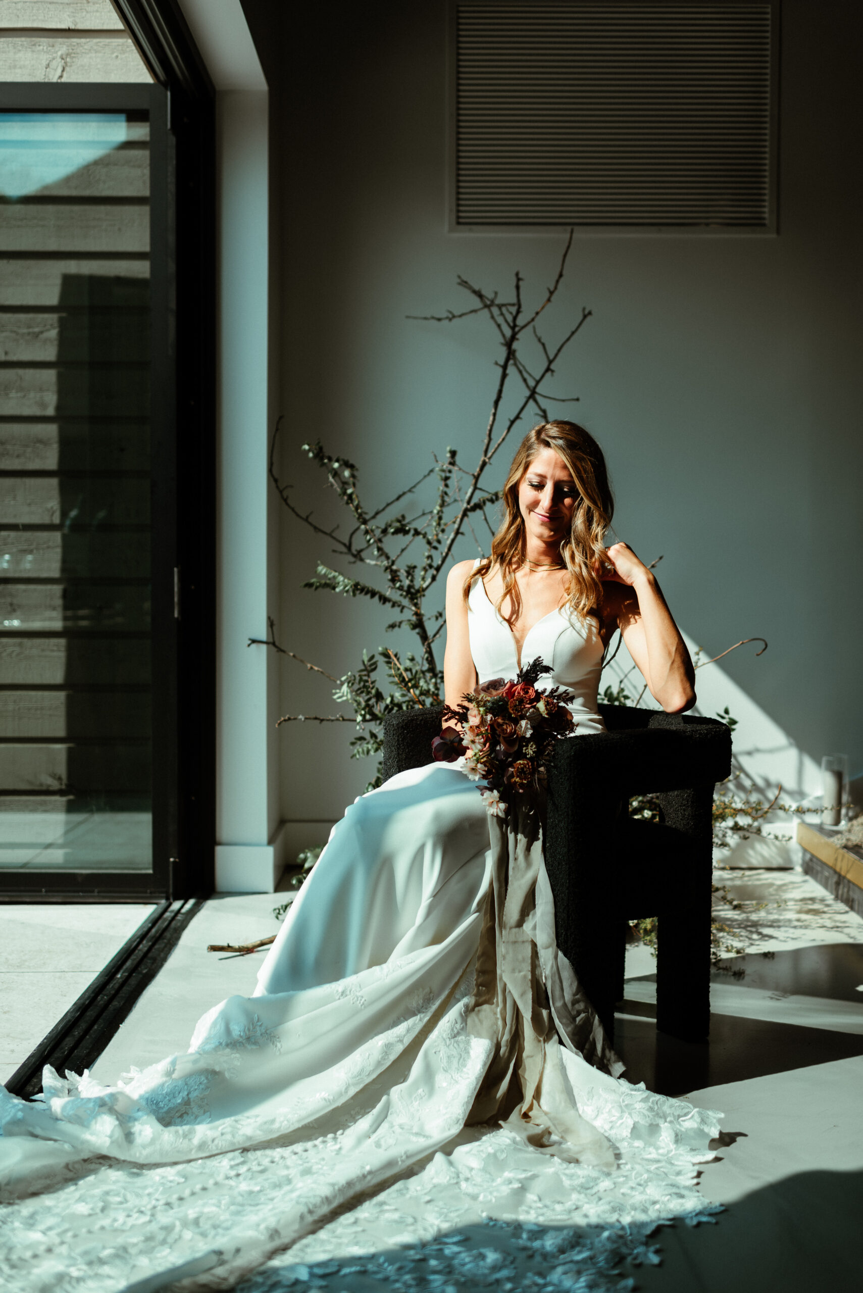Katrina posing with bridal bouquet created by Fiori Florals a Columbus Florist