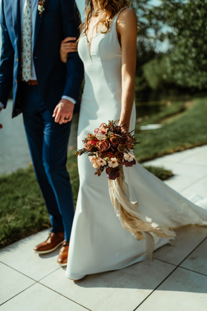 Bride and Groom walking with bridal Bouquet created by Fiori Florals a Columbus Based Florist